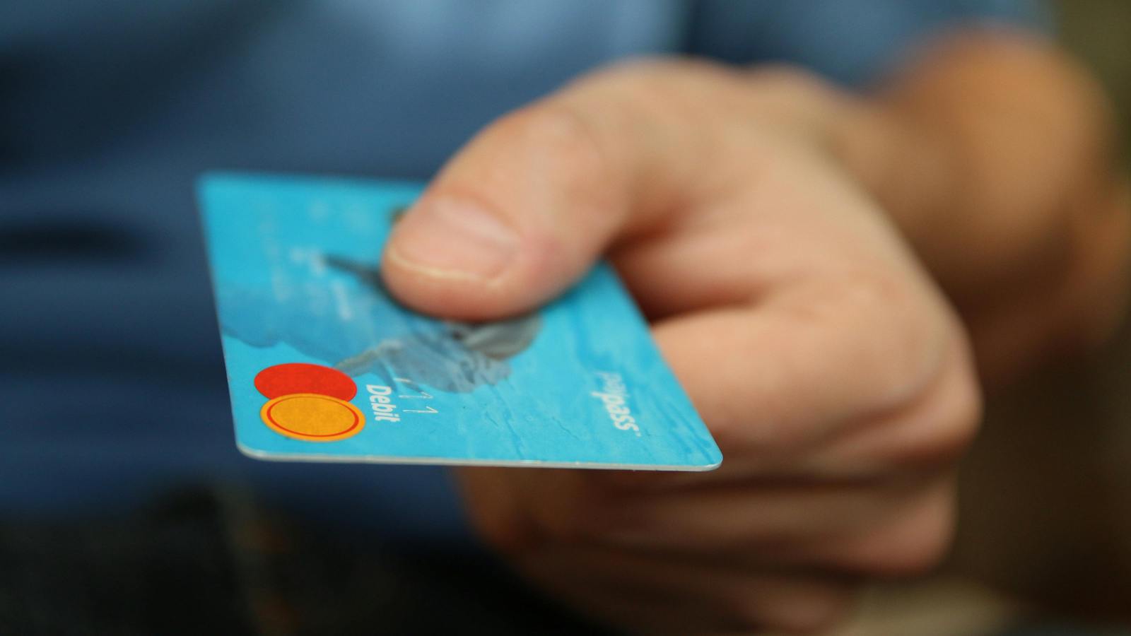 Person holds debit card