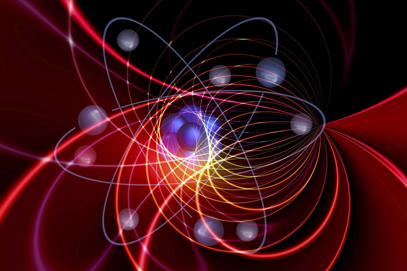 Blue balls joined together to form a neutron surrounded in orbit by other balls representing electrons along with many bright colors and other rings all representing quantum physics