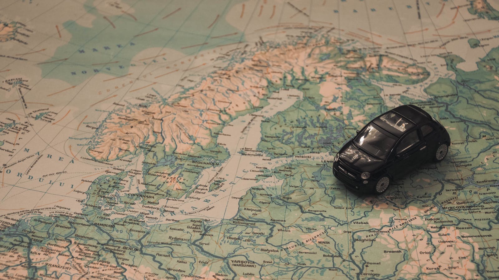 Toy car on map of Europe