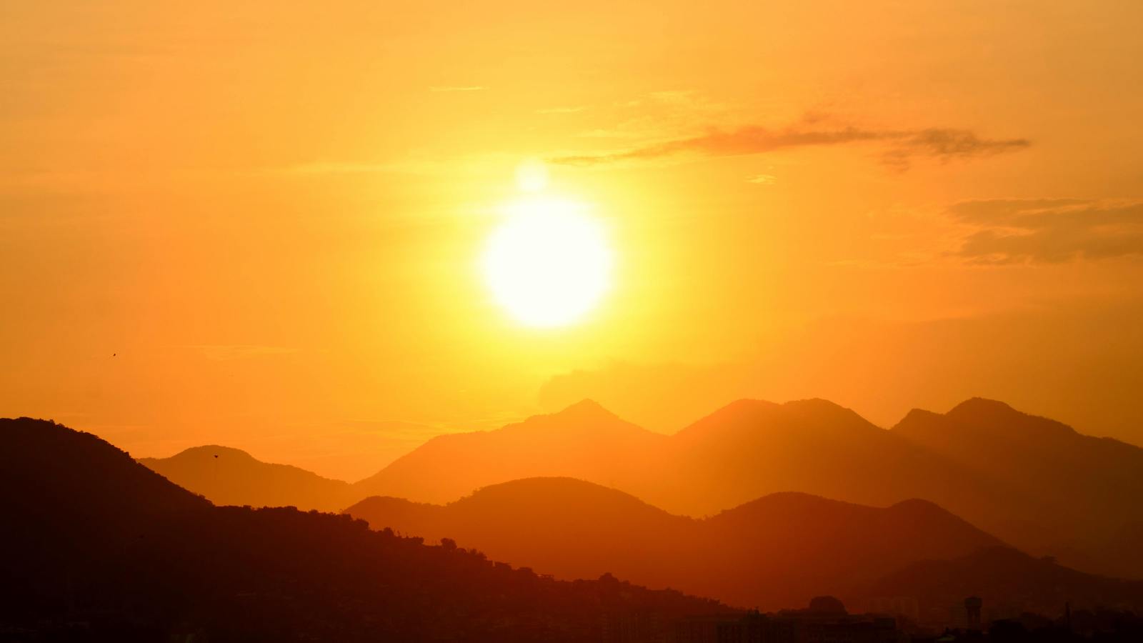 Silhouette Photo of a Mountain During Sunset