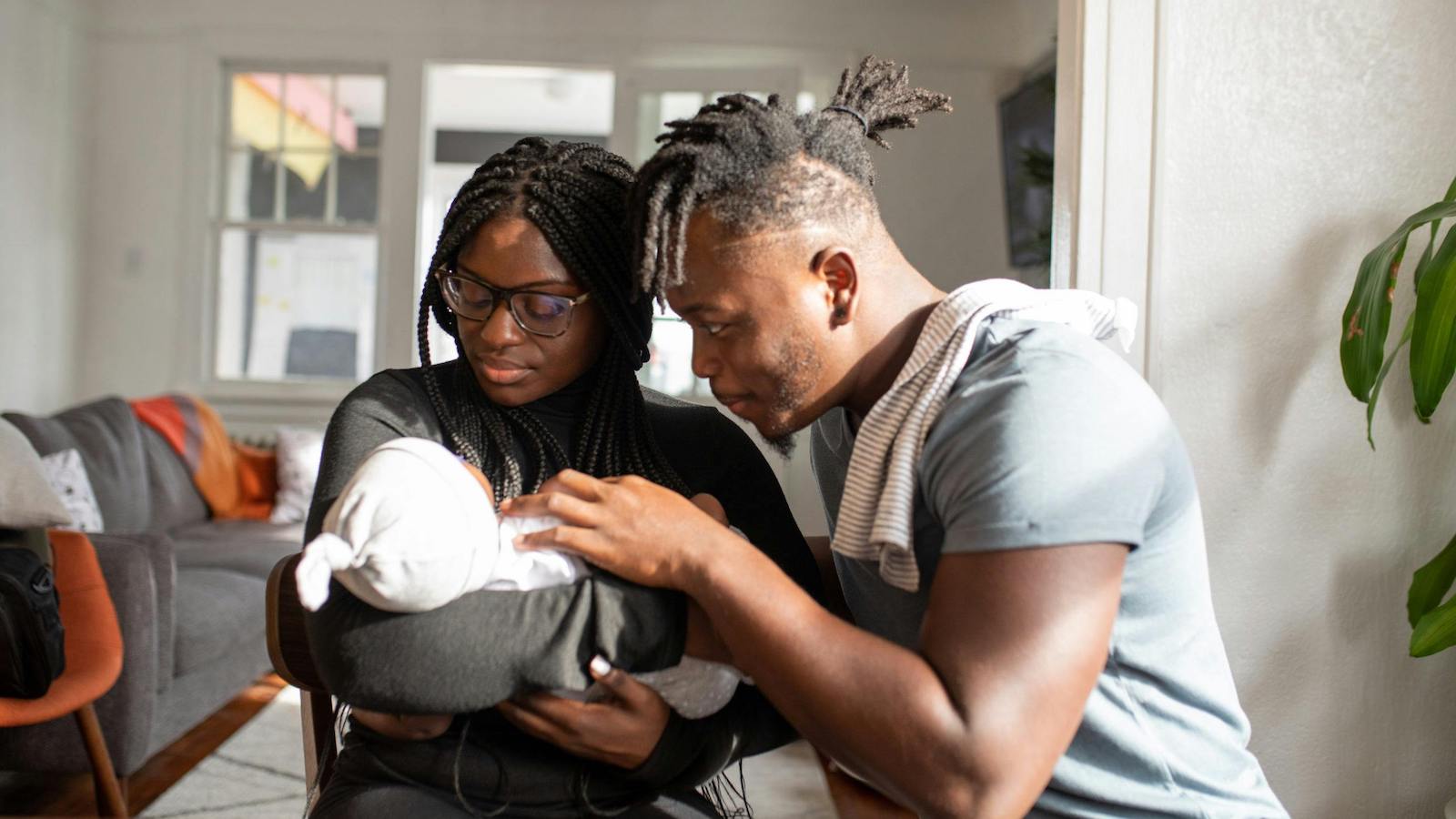 Parents Looking at their Baby