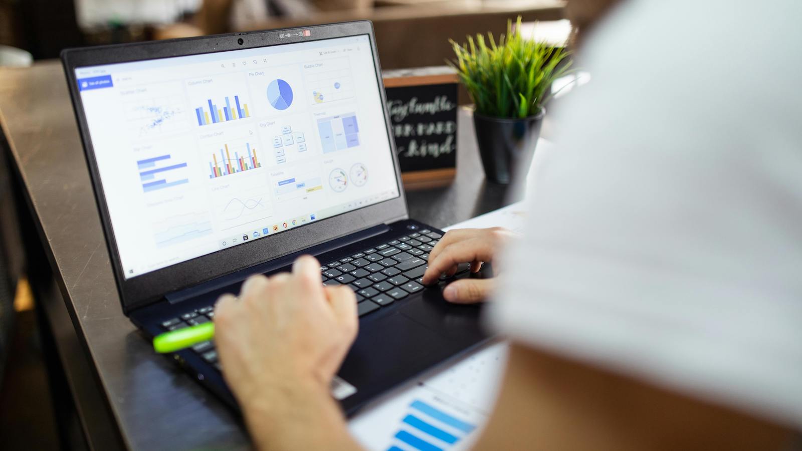 Person looking at graphs on a computer