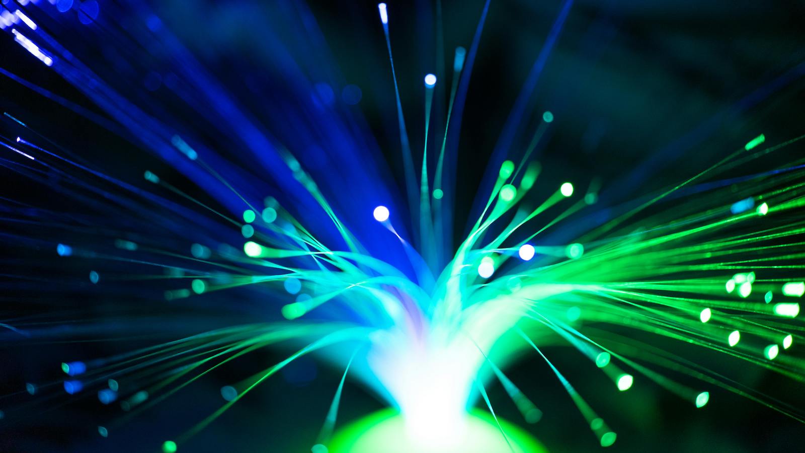 Close-Up Shot of a Green and Blue Fiber Optic