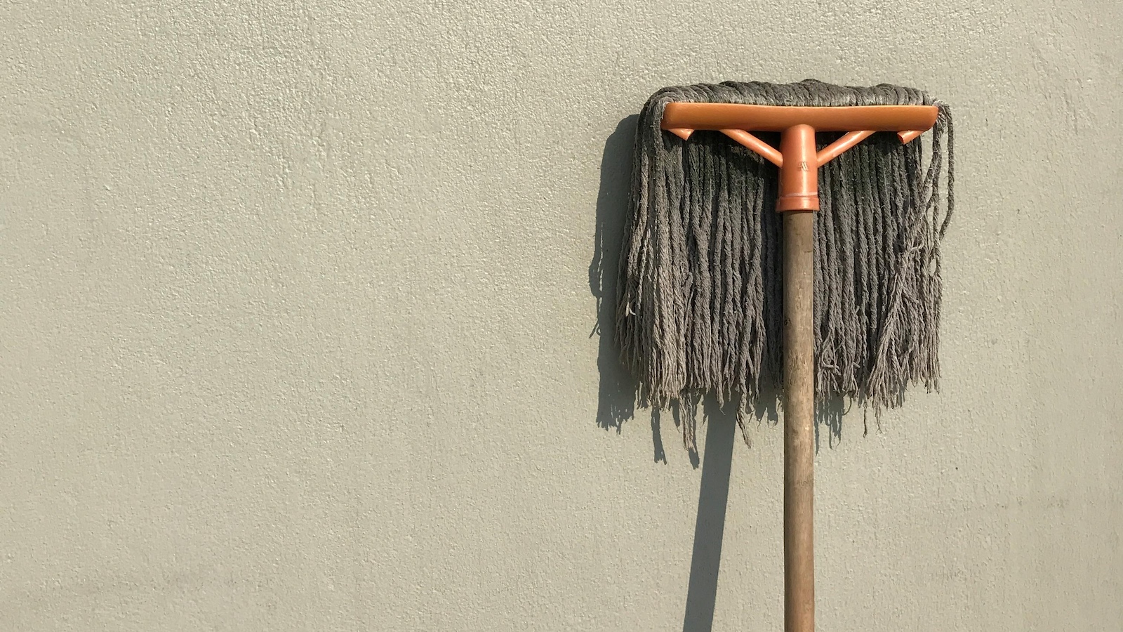 Gray and Brown Floor Mop on White Wall