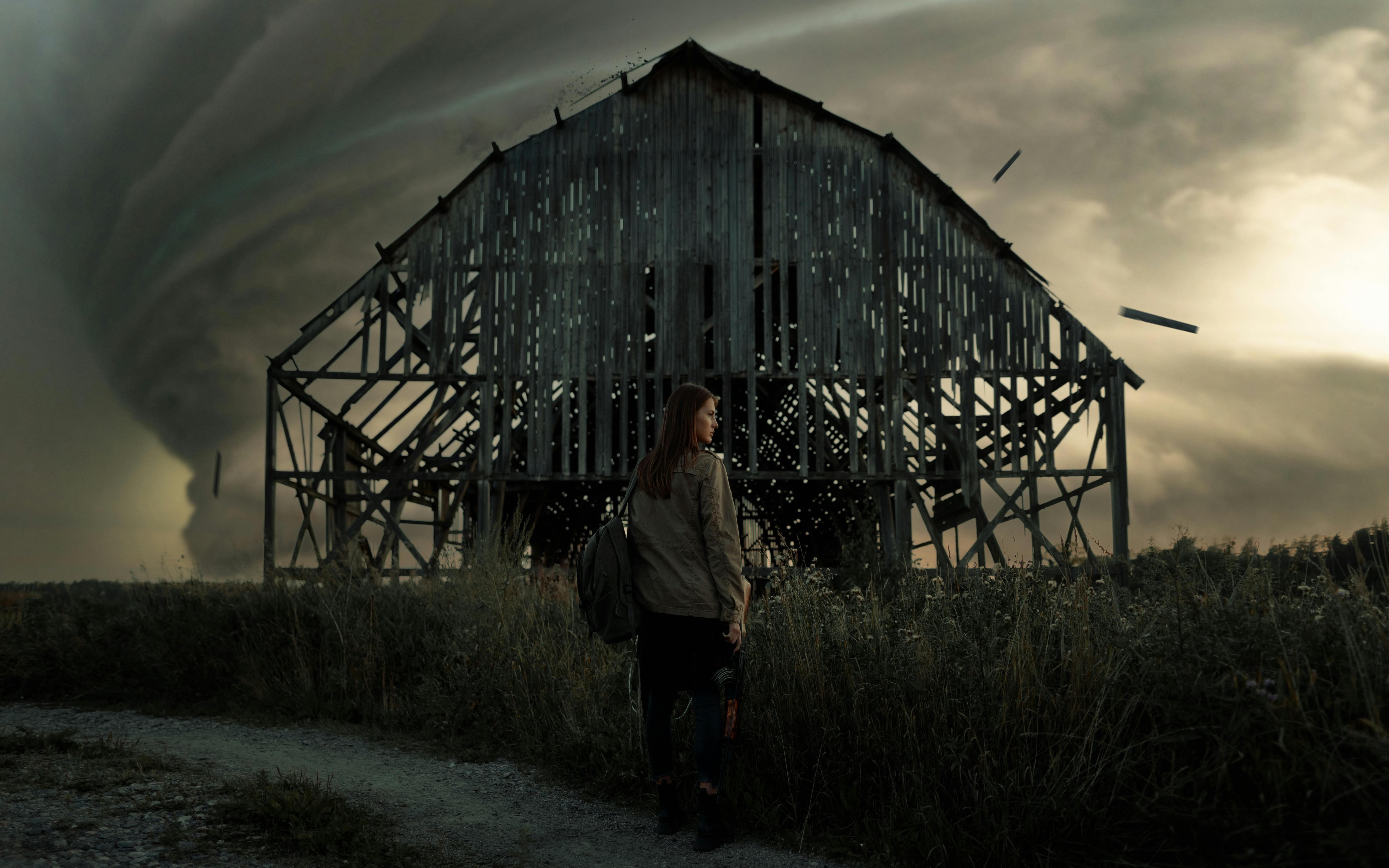 Woman standing near a Desolated Farm House