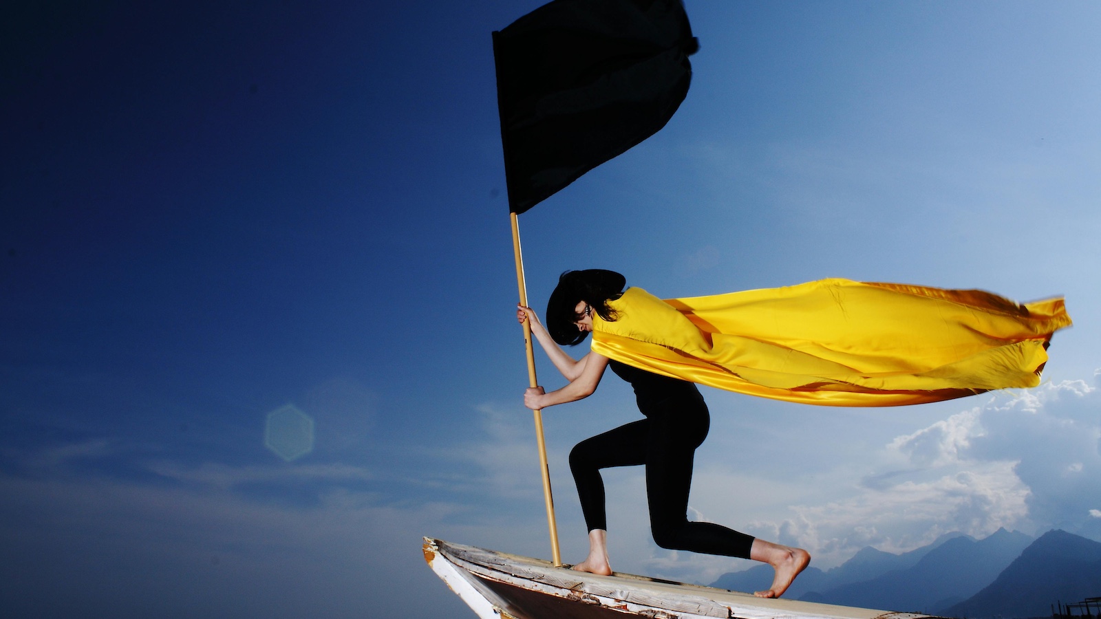 Woman Holding Black Flag