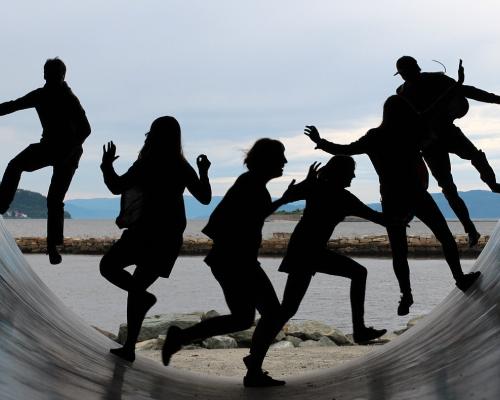 people jumping inside a cylinder