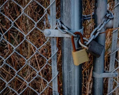 Padlocks on Chain Link Fence