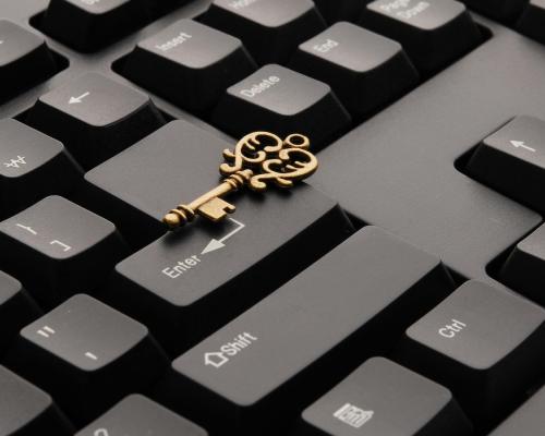 Brass Ornate Vintage Key on Black Computer Keyboard