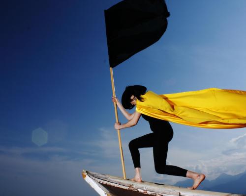 Woman Holding Black Flag