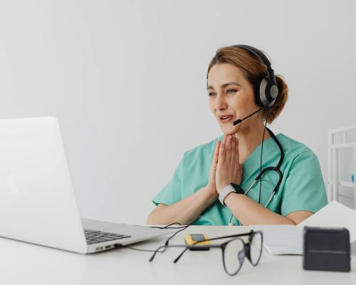 doctor-using-a-laptop-to-see-a-patient